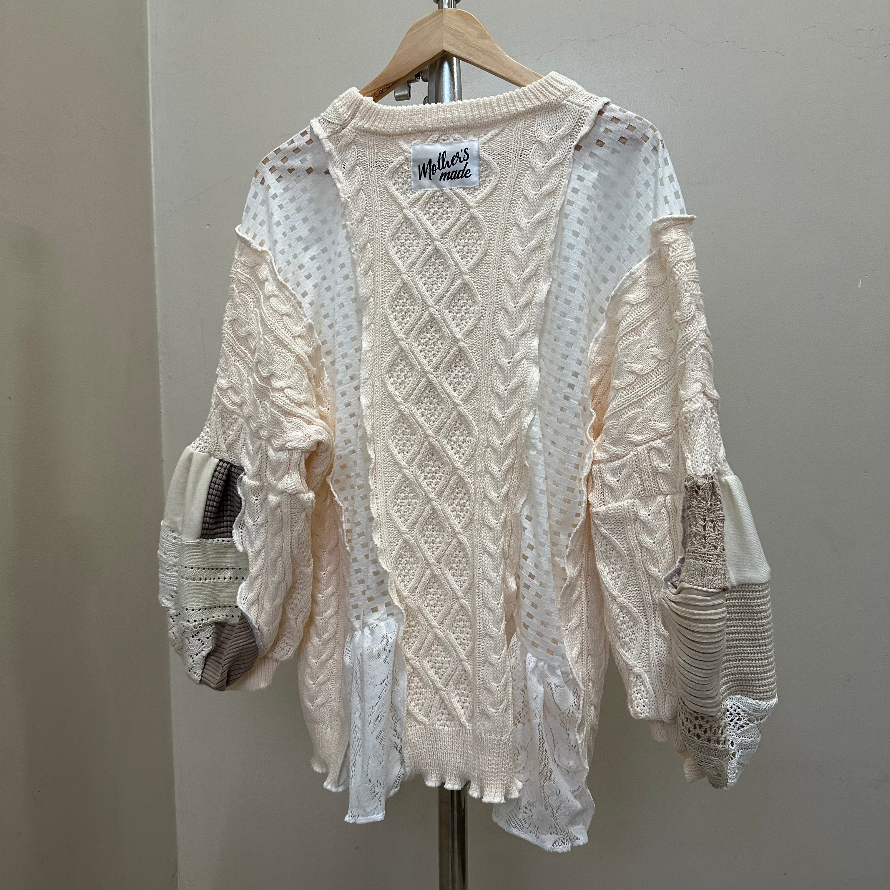 パッチワーク袖のニットセーター